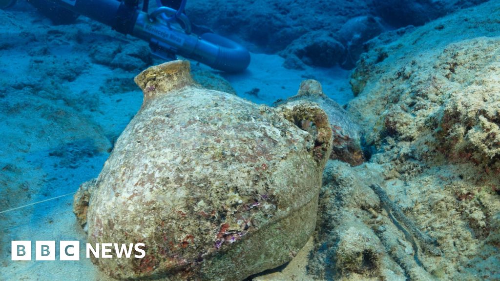 Diver studying amphorae at the Kekova shipwreck site