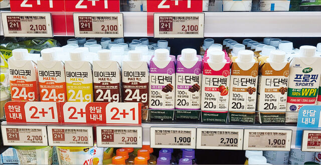 Protein drinks displayed on shelves in a Korean convenience store