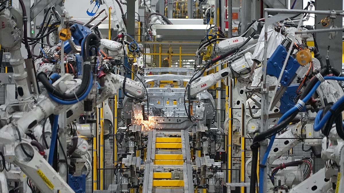 Industrial robots working in a factory setting