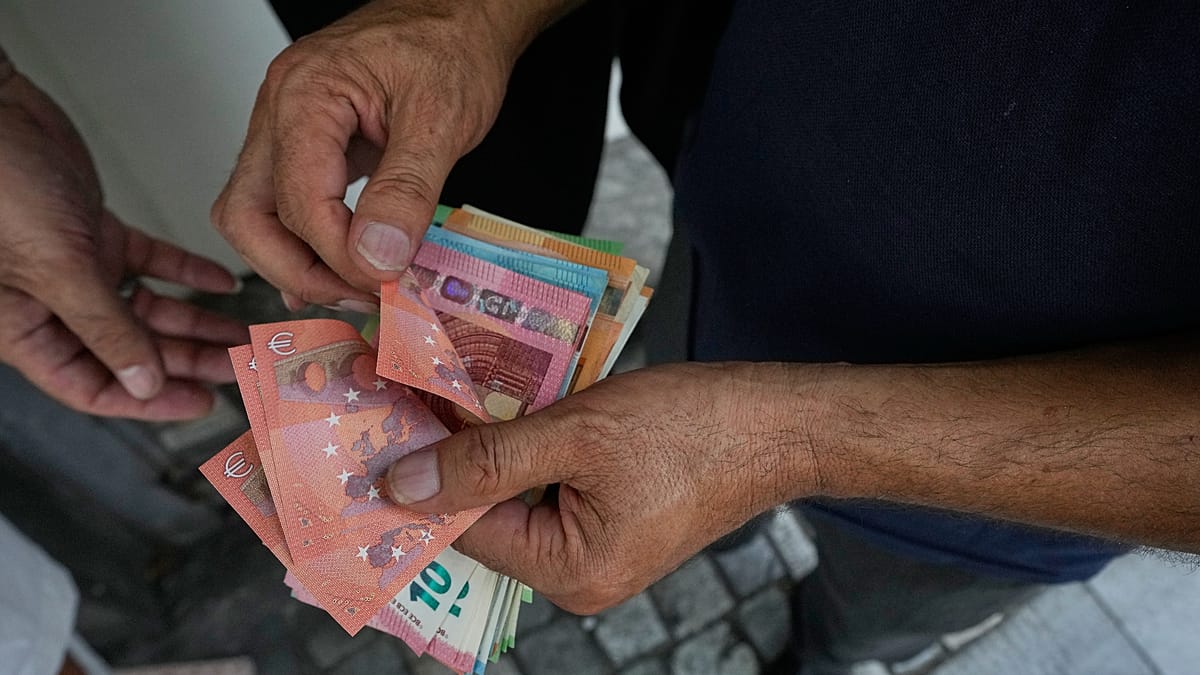 Euro slides to fresh lows against US dollar and British pound