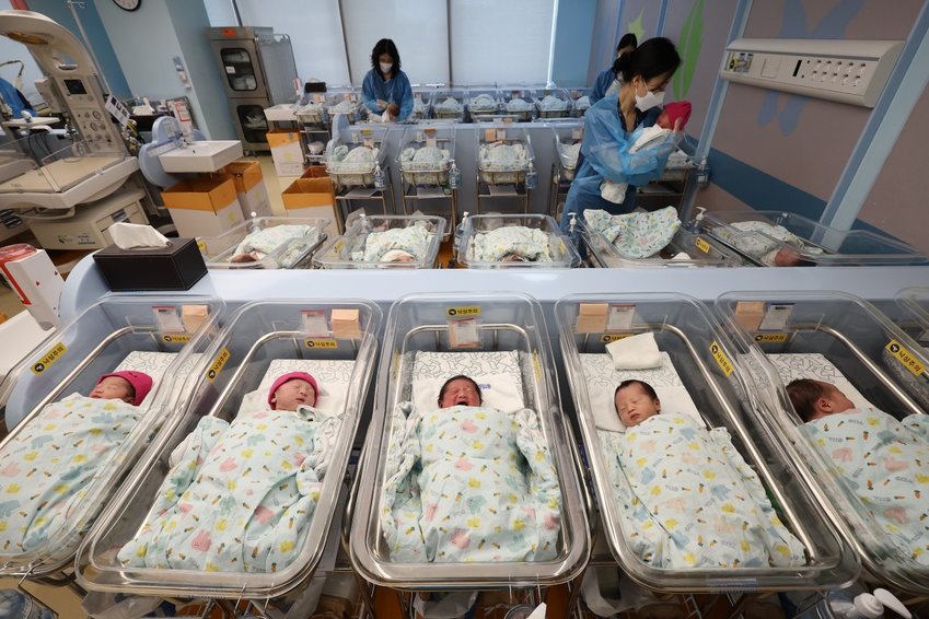Nurses caring for newborns at a hospital nursery in Ilsan, South Korea