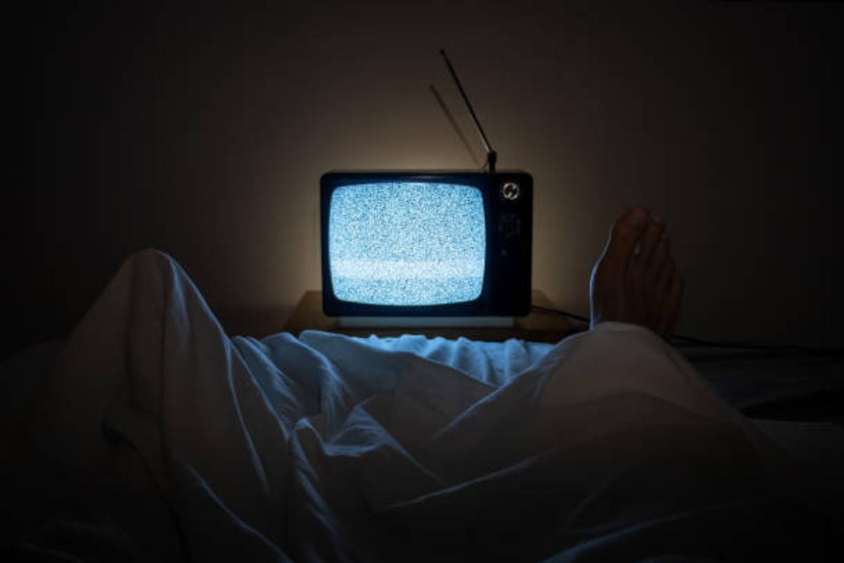 Person using smartphone in bed