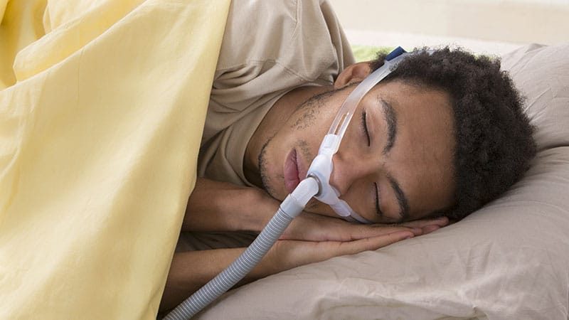 Man using CPAP machine