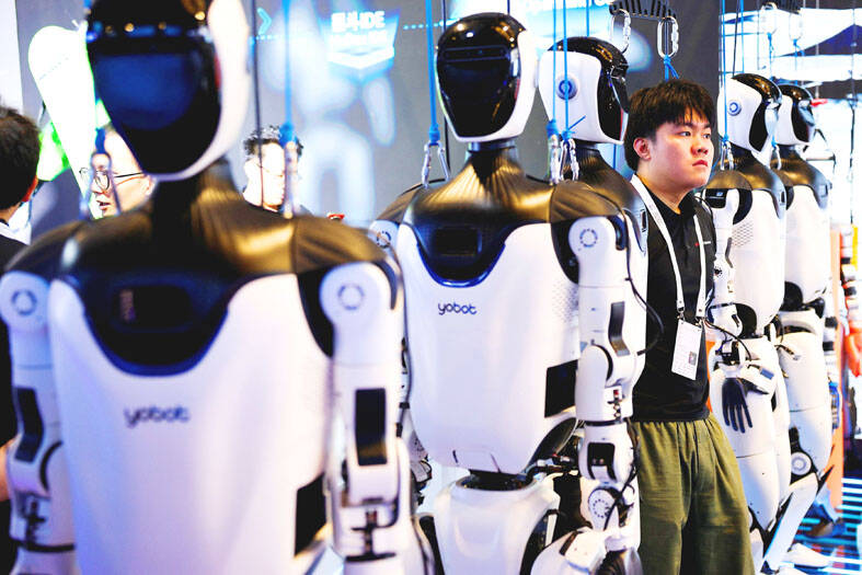 Chinese factory workers assembling AI accelerators and data center equipment