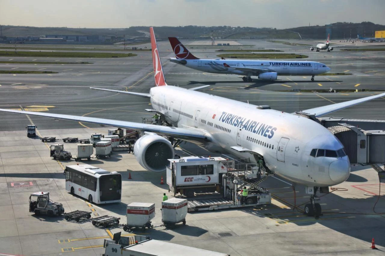 Turkish airport terminal with planes in background