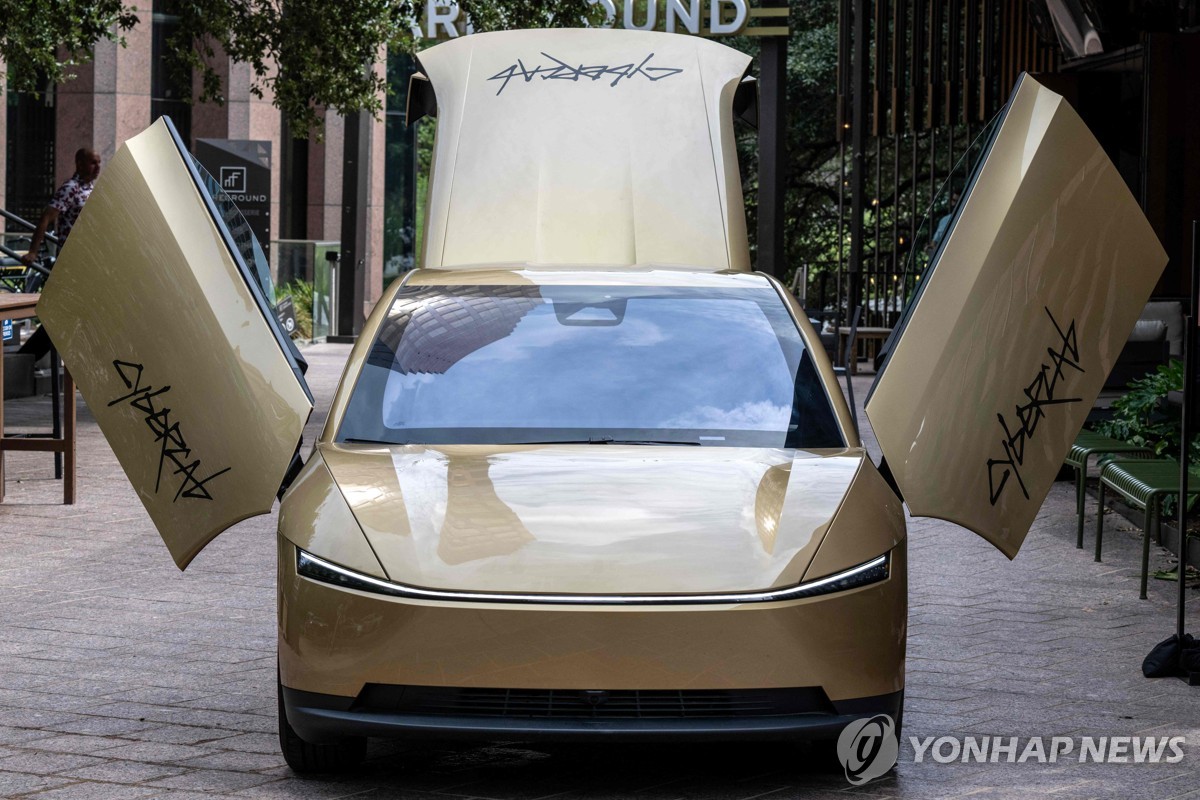 Golden Cybercab with scissor doors unveiled at Austin event