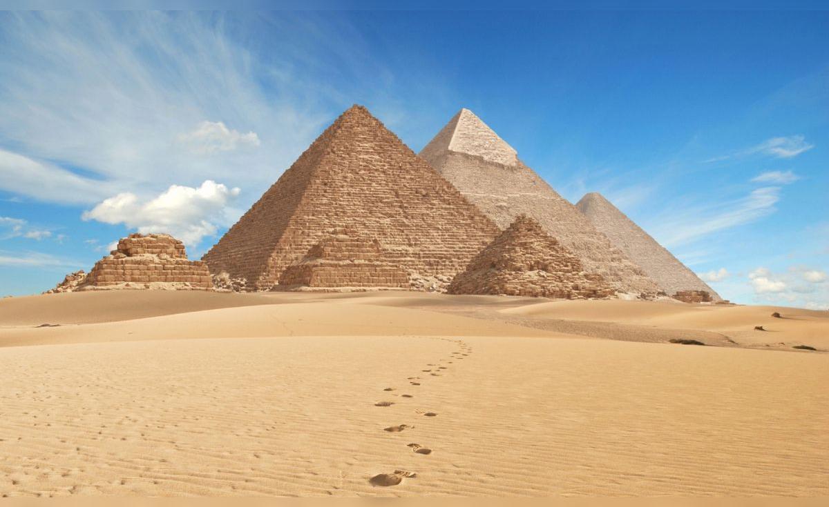 Ancient Egyptian city ruins under sand