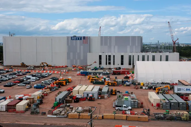 Construction workers on a site, illustrating the labor constraints in data center building.
