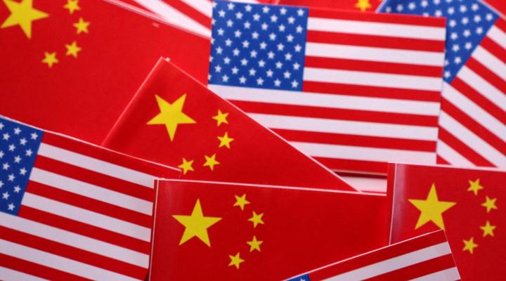 US and China flags representing escalating economic tensions