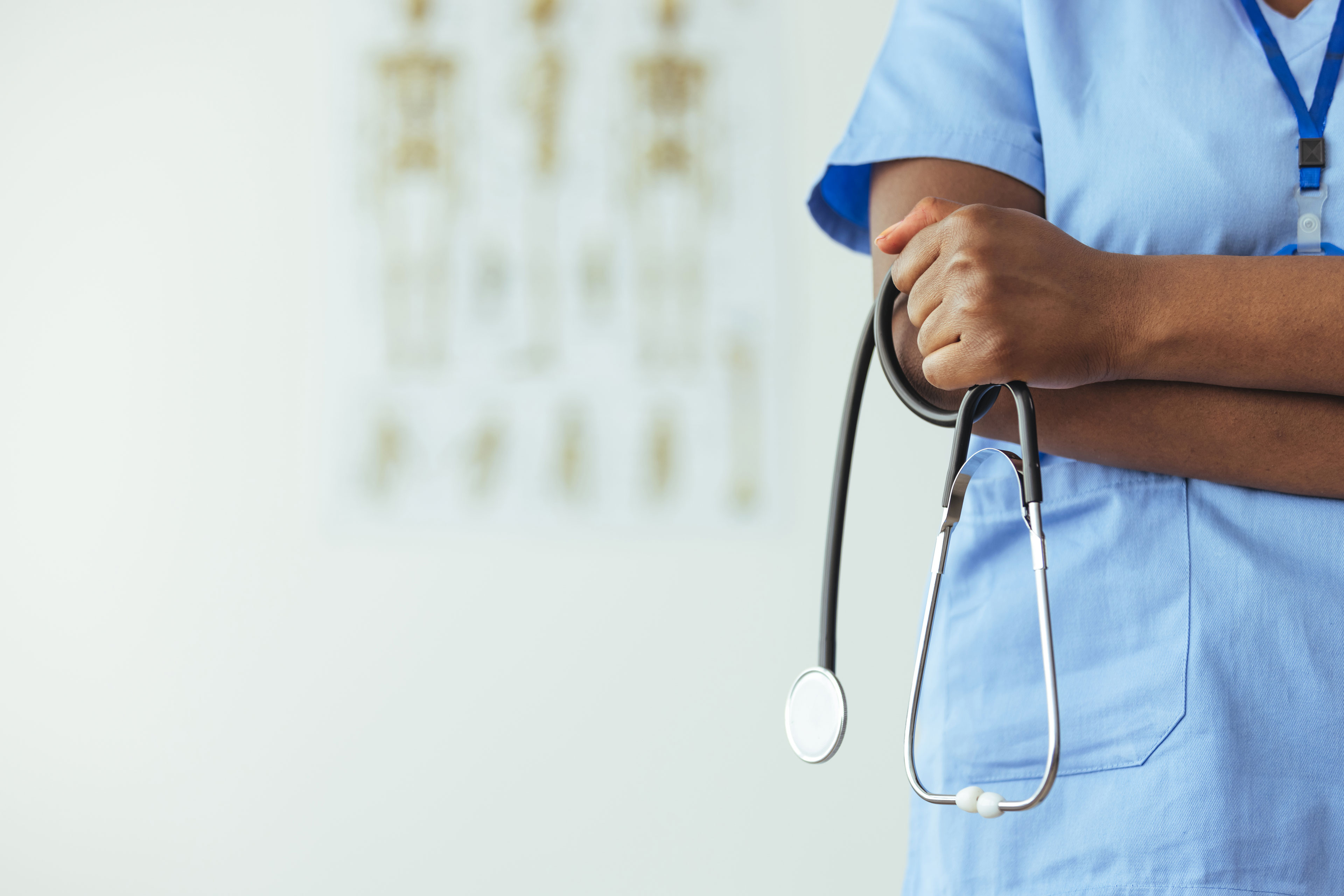 KFF Health News coverage of state AI insurance regulation — a person navigating health insurance paperwork