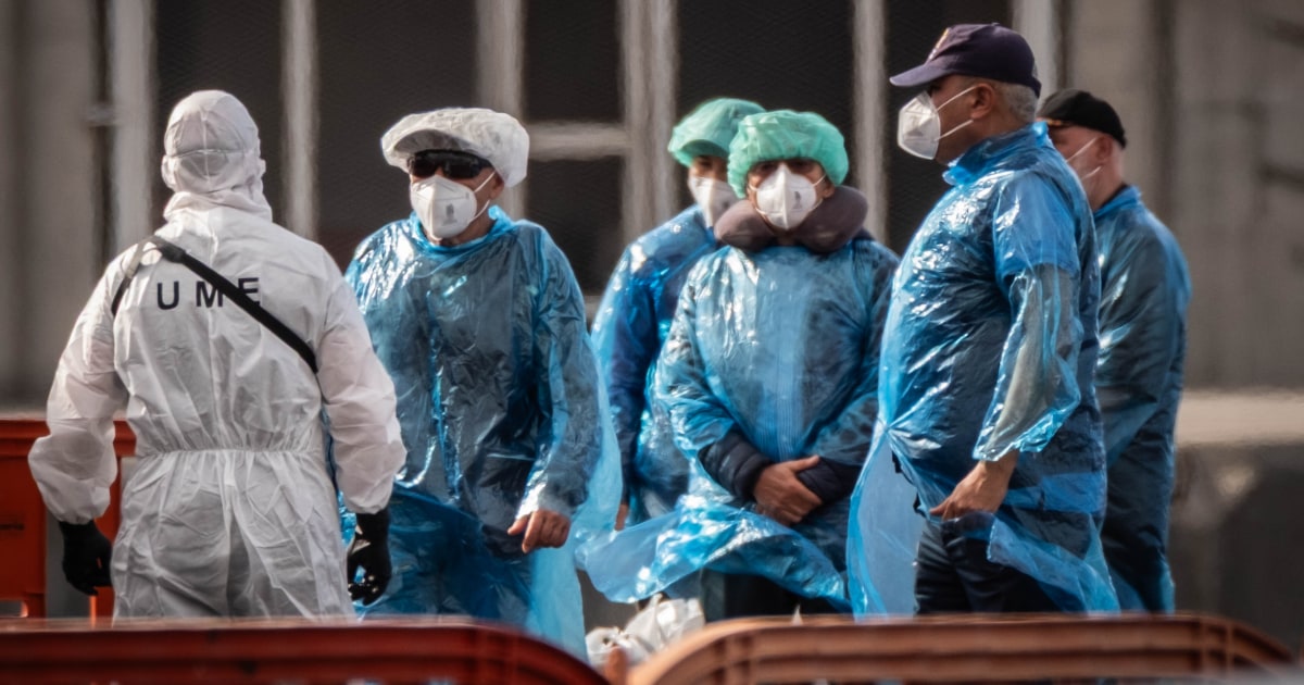 Health workers in protective gear responding to the hantavirus outbreak linked to cruise ship cases