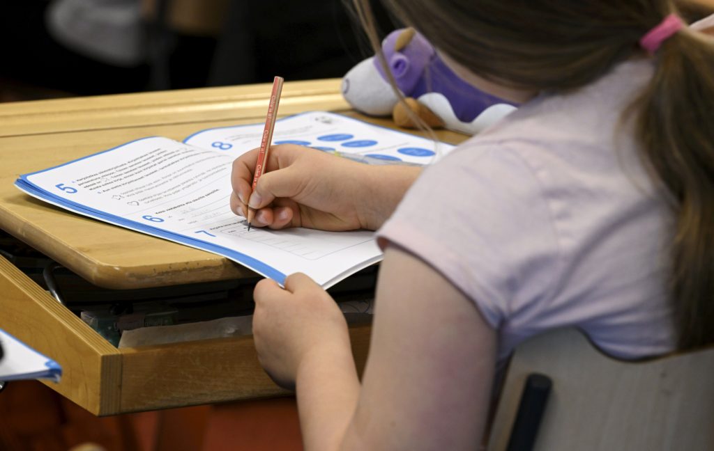 Finnish classroom scene illustrating traditional vs digital learning
