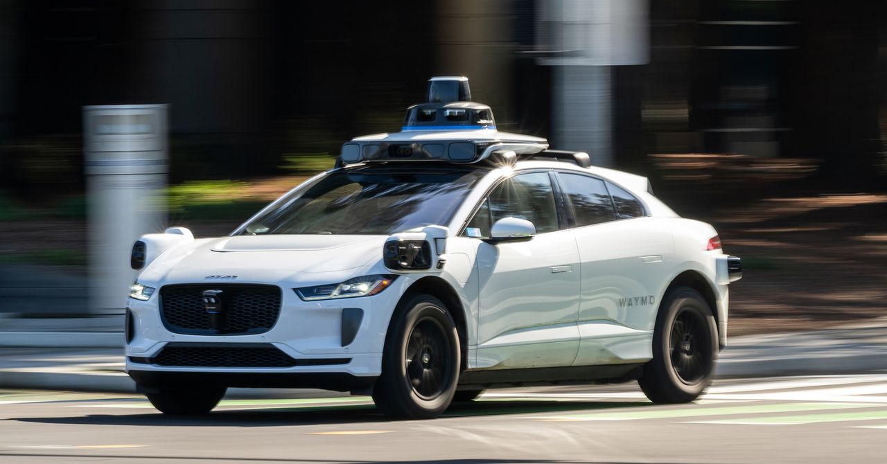 Waymo robotaxi driving in an urban environment