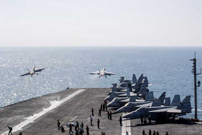 Aircraft carrier operations in Middle Eastern waters during escalating Iran tensions.