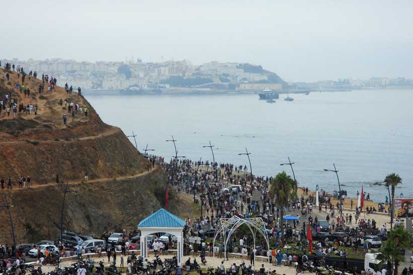 Ceuta waterfront with migrants and Spanish security forces