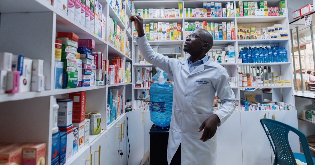 Zendawa AI medicine supply platform in Africa — a healthcare worker at a pharmacy counter