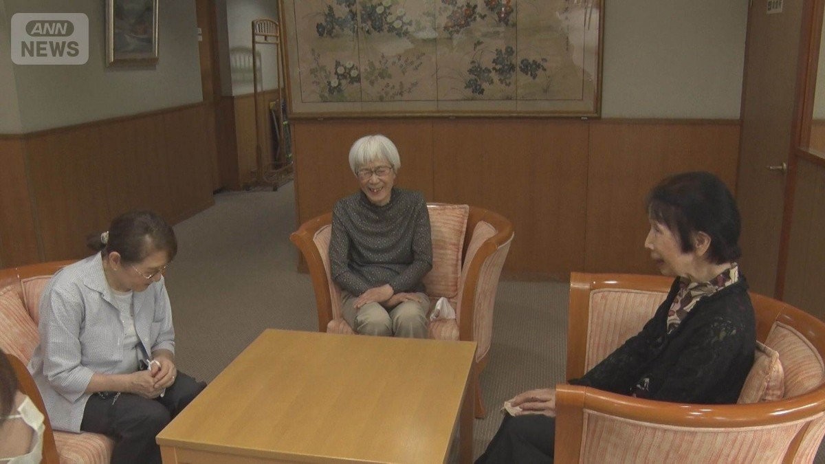 Seniors participating in activities in the living room of a Japanese nursing facility