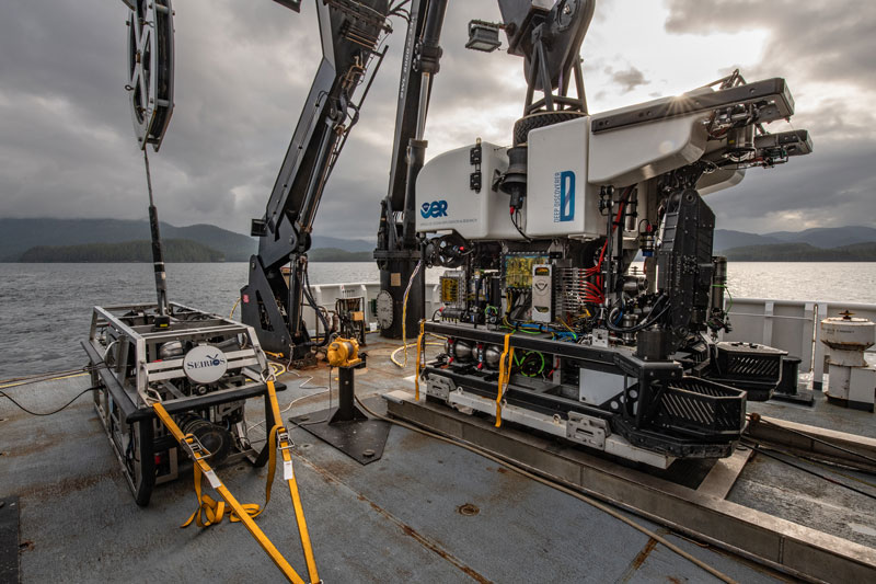 Autonomous underwater vehicle deployed from research vessel to survey deep-sea features and collect bathymetric data