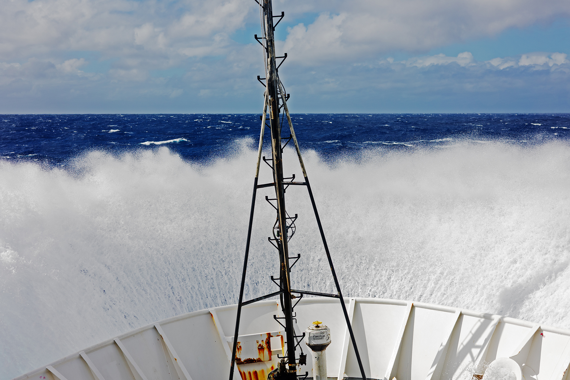 Waves crashing over the bow of NOAA Ship Okeanos Explorer during the 2026 Cook Islands ROV Exploration
