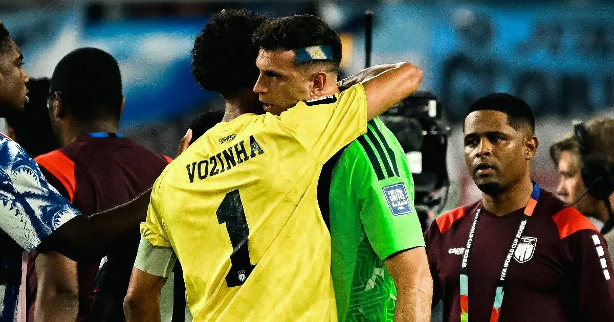 Two goalkeepers comforting a Cape Verde player after Argentina's victory