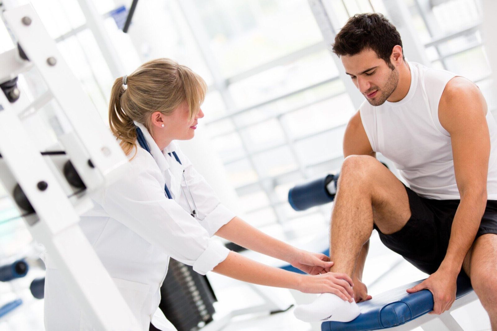 Athlete performing rehabilitation exercises in clinical setting