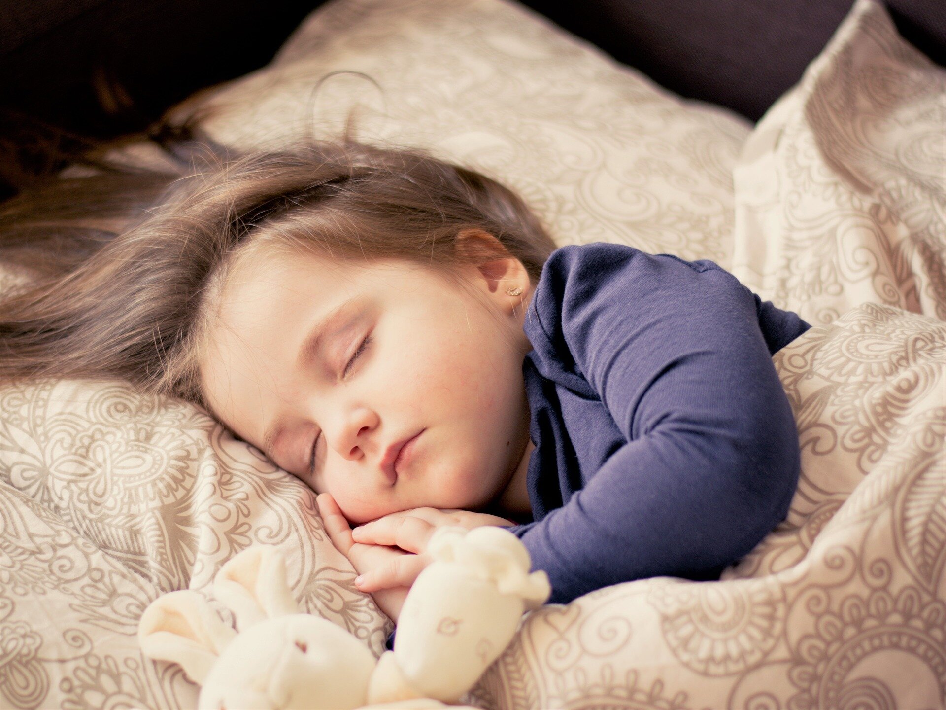 Baby sleeping peacefully in a crib