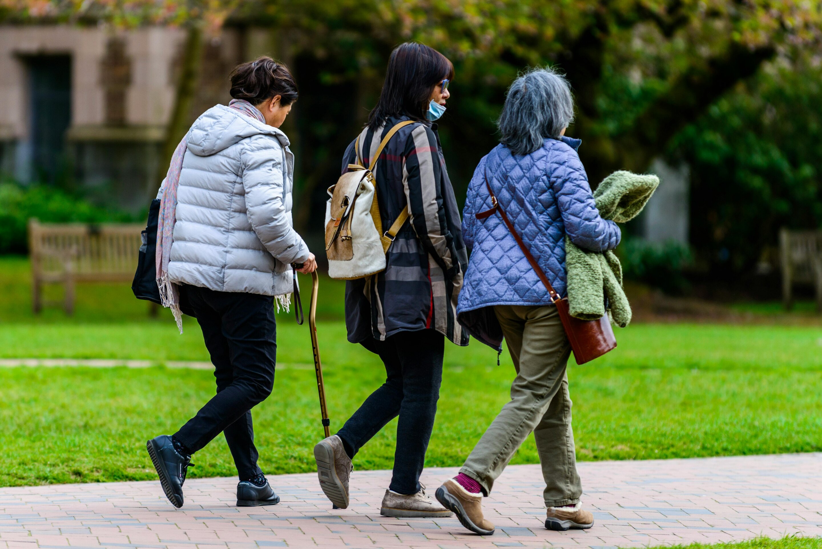 Older women walking outdoors during health study