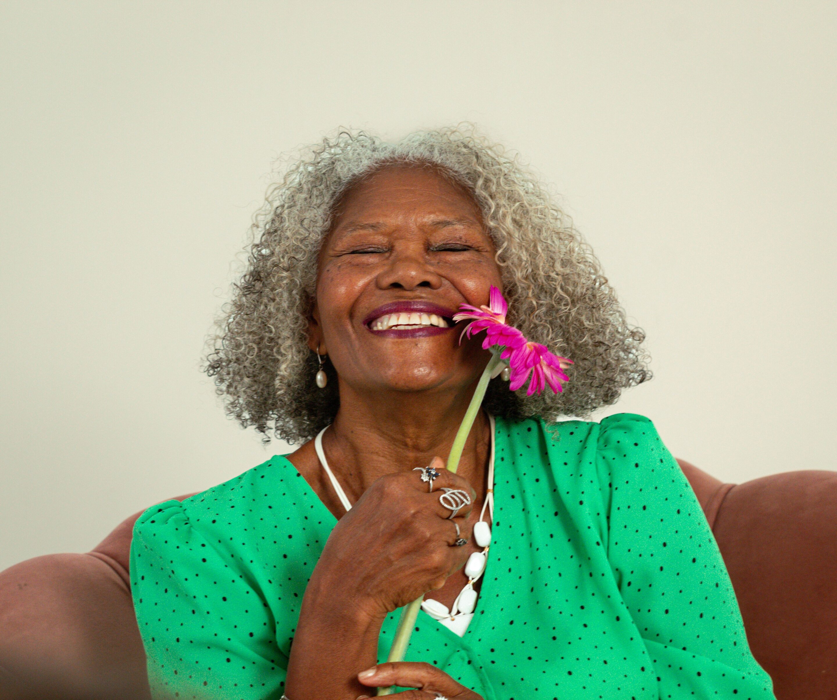 Laughing elderly person illustrating positive aging