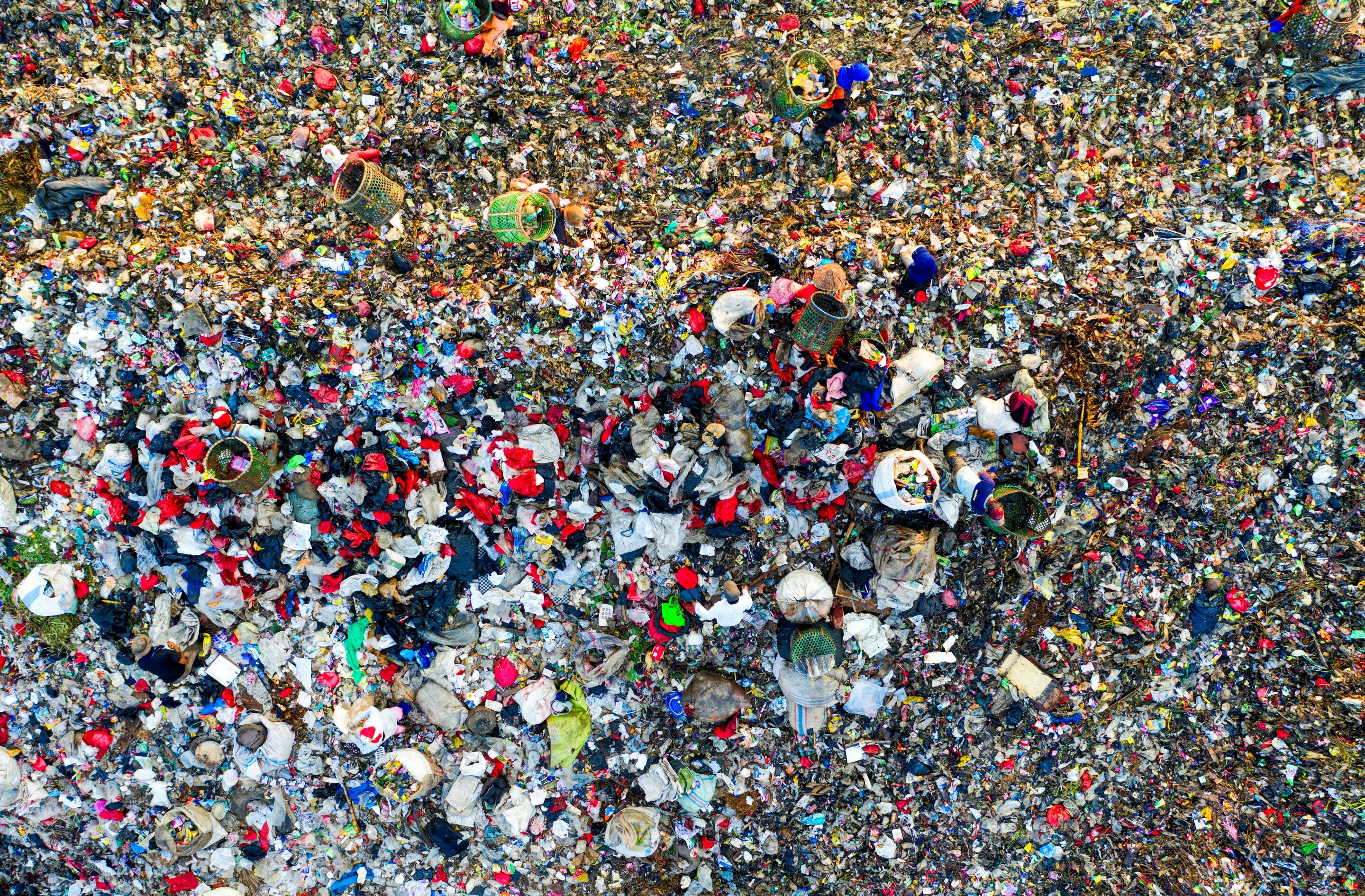 Colorful microplastics shown under magnification, illustrating their atmospheric warming potential