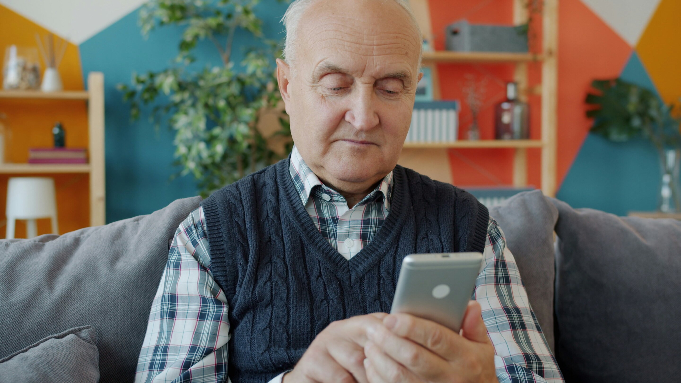 Older adult using smartphone for cognitive training