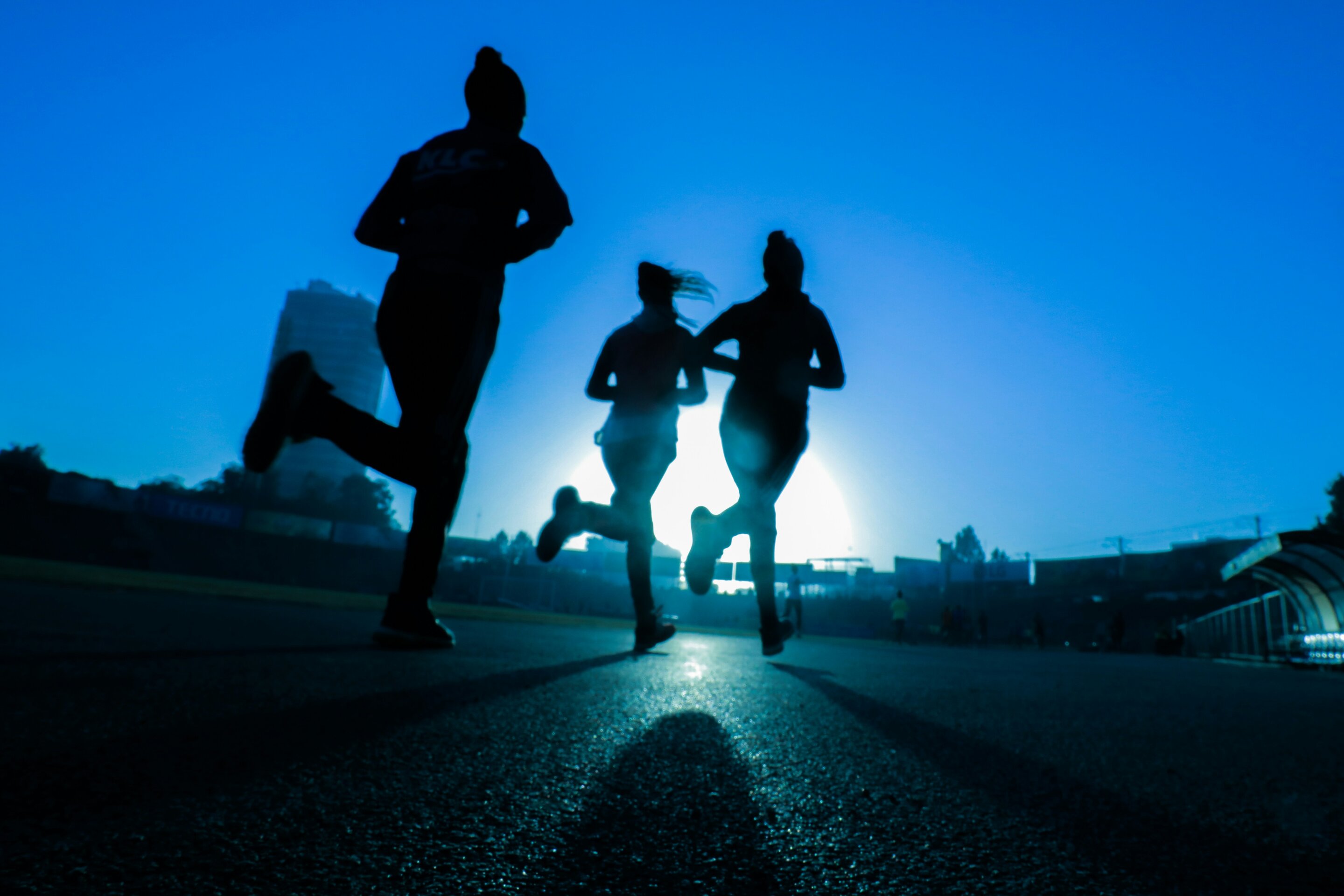 A person engaged in high-intensity exercise outdoors, demonstrating physical activity as mental health support