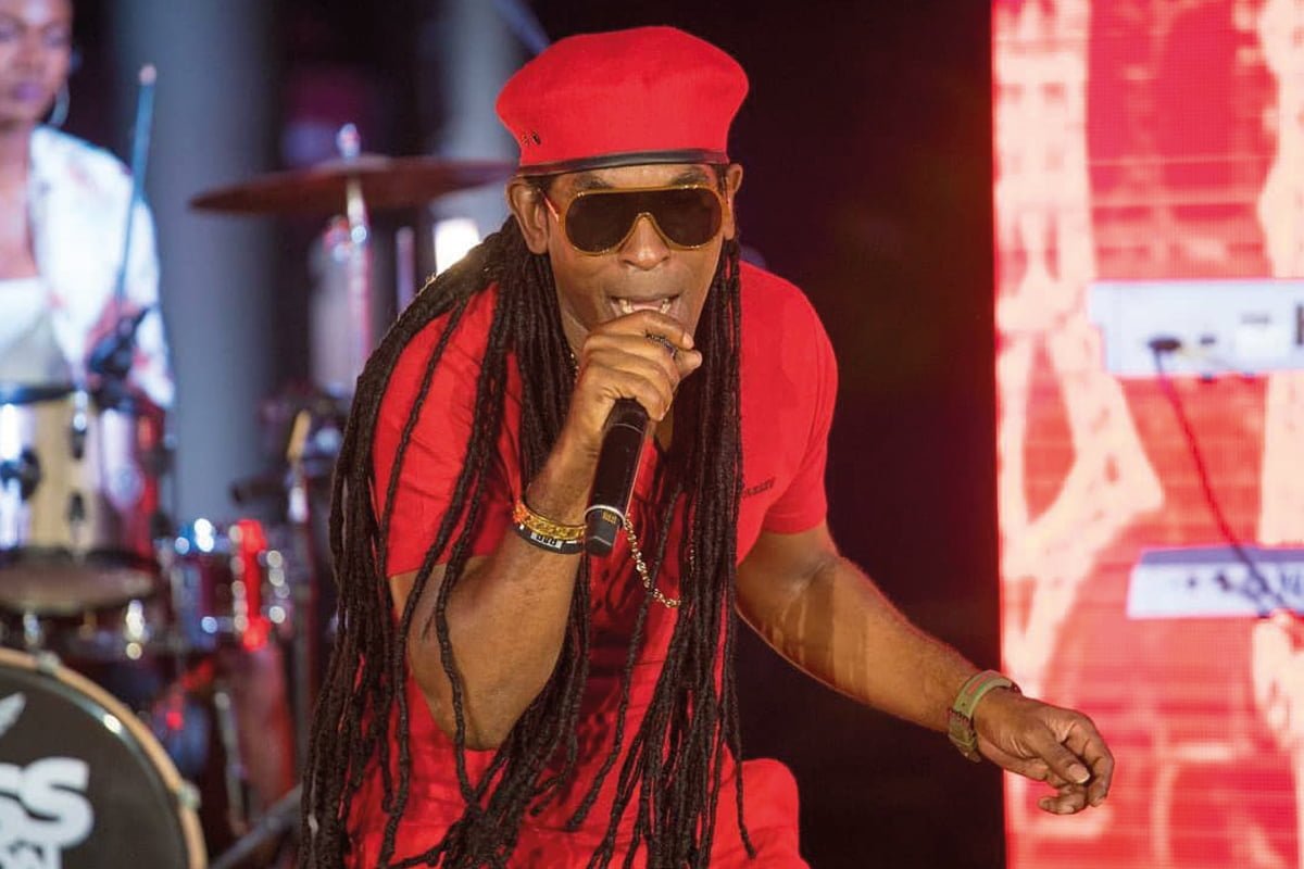 Farmer Nappy performing at Nadia Batson's Artform, representing the high-energy performances typical of the Soca Monarch