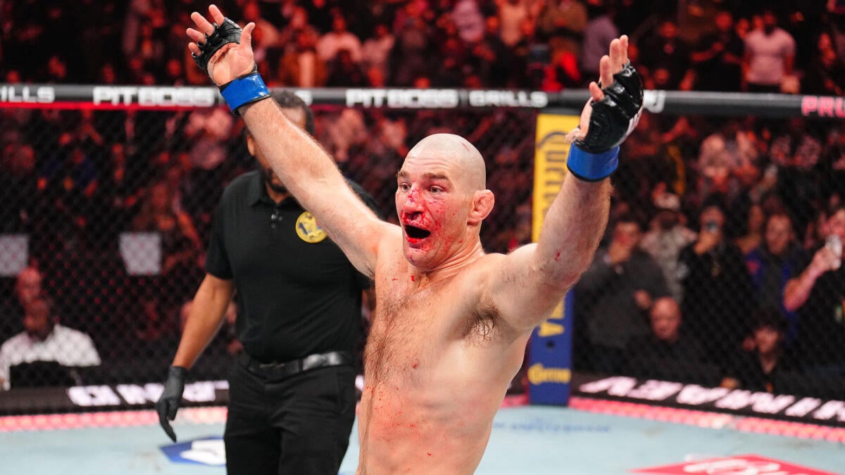 Sean Strickland raises his hand after defeating Khamzat Chimaev at UFC 328