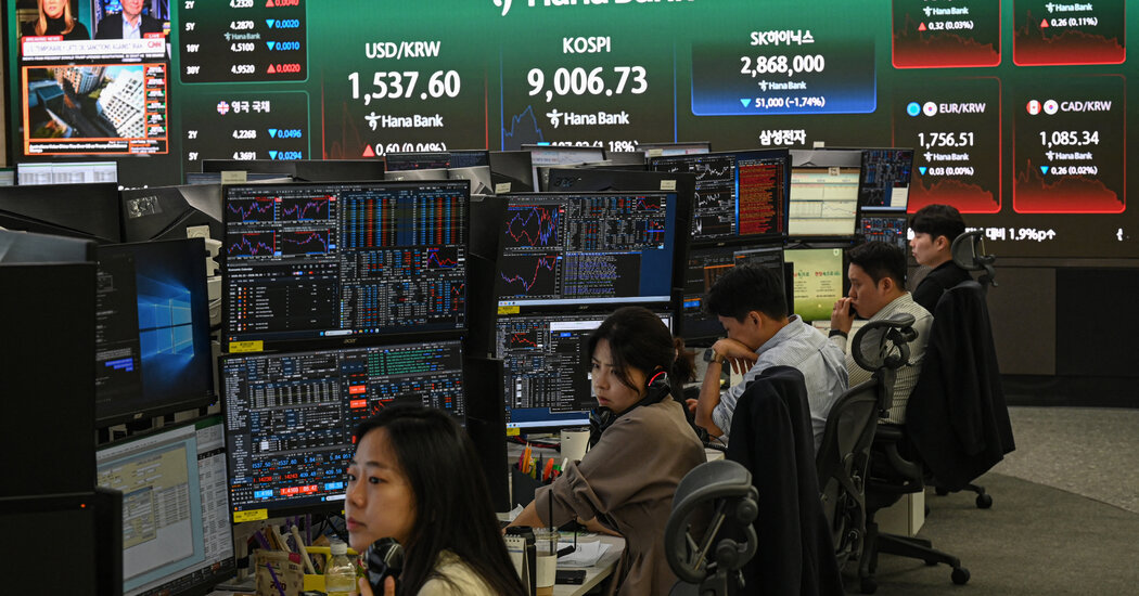 Traders at the Korea Exchange monitor the sharp decline in tech stocks.