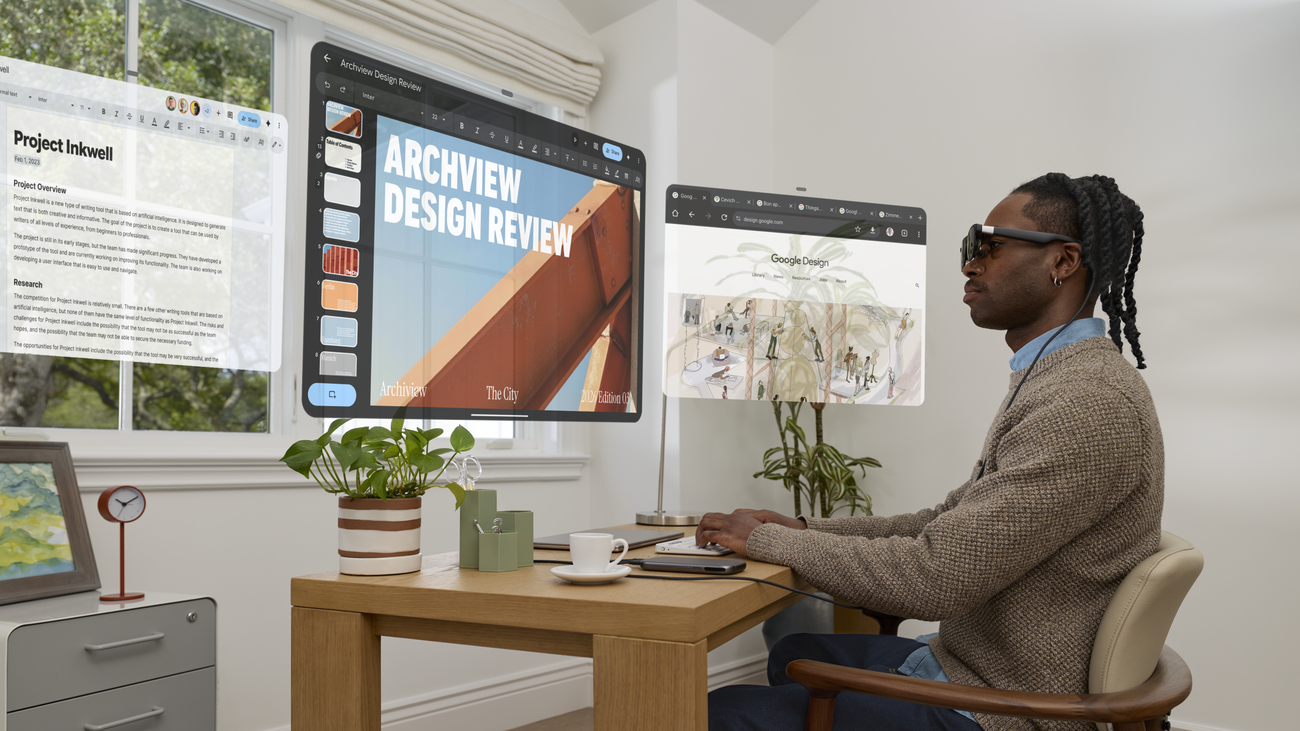 Man using XREAL AURA glasses in an office setting