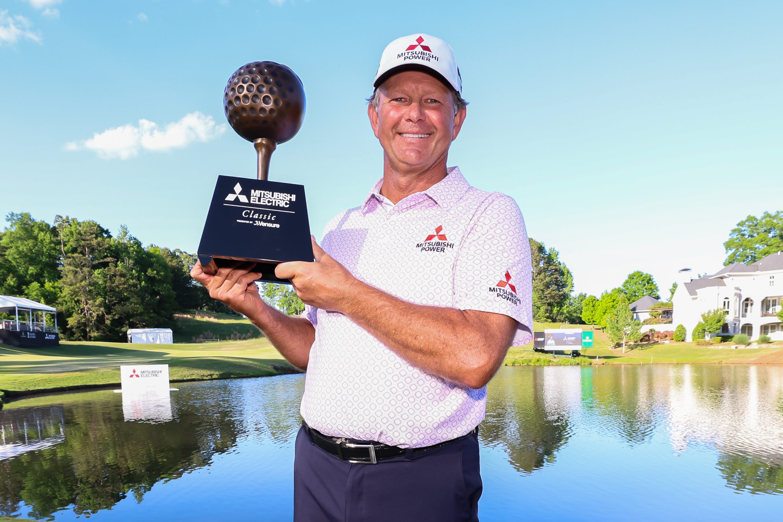 Retief Goosen poses with the trophy after winning the 2026 Mitsubishi Electric Classic at TPC Sugarloaf