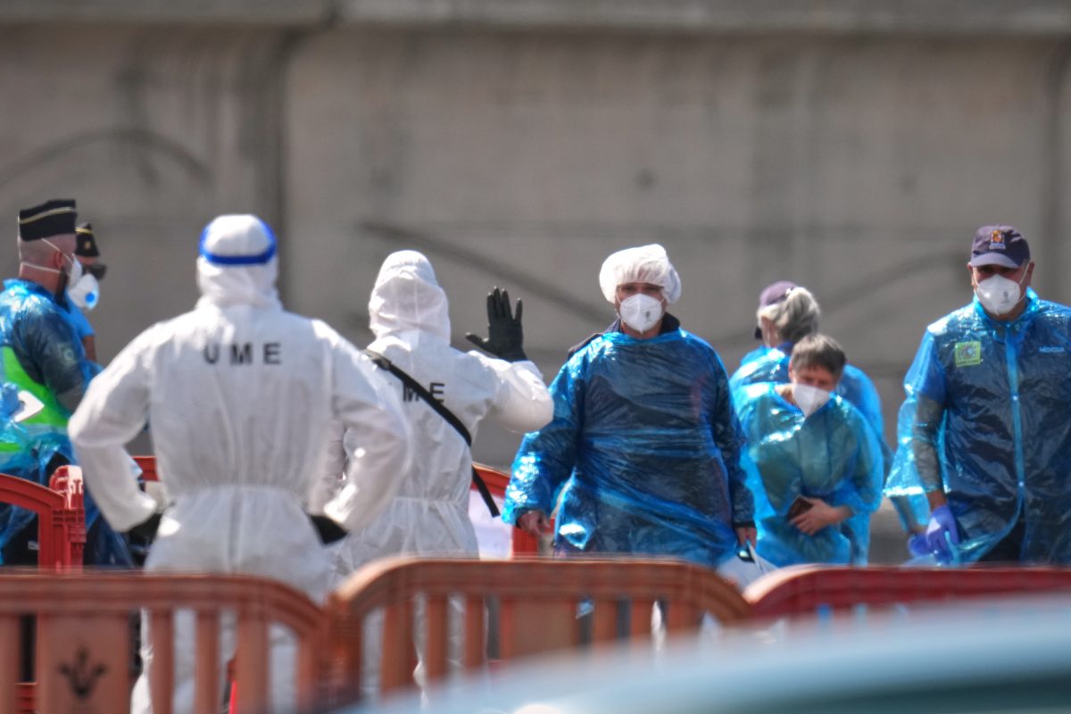 PPE-clad passengers disembarking from the hantavirus-affected cruise ship