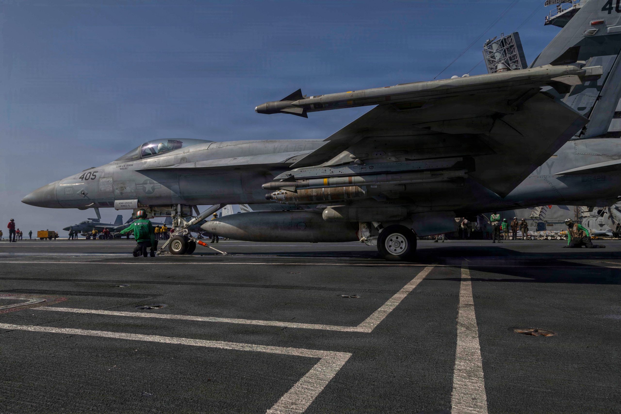 Image showing US and Iranian leaders weighing military action amid diplomatic deadlock.