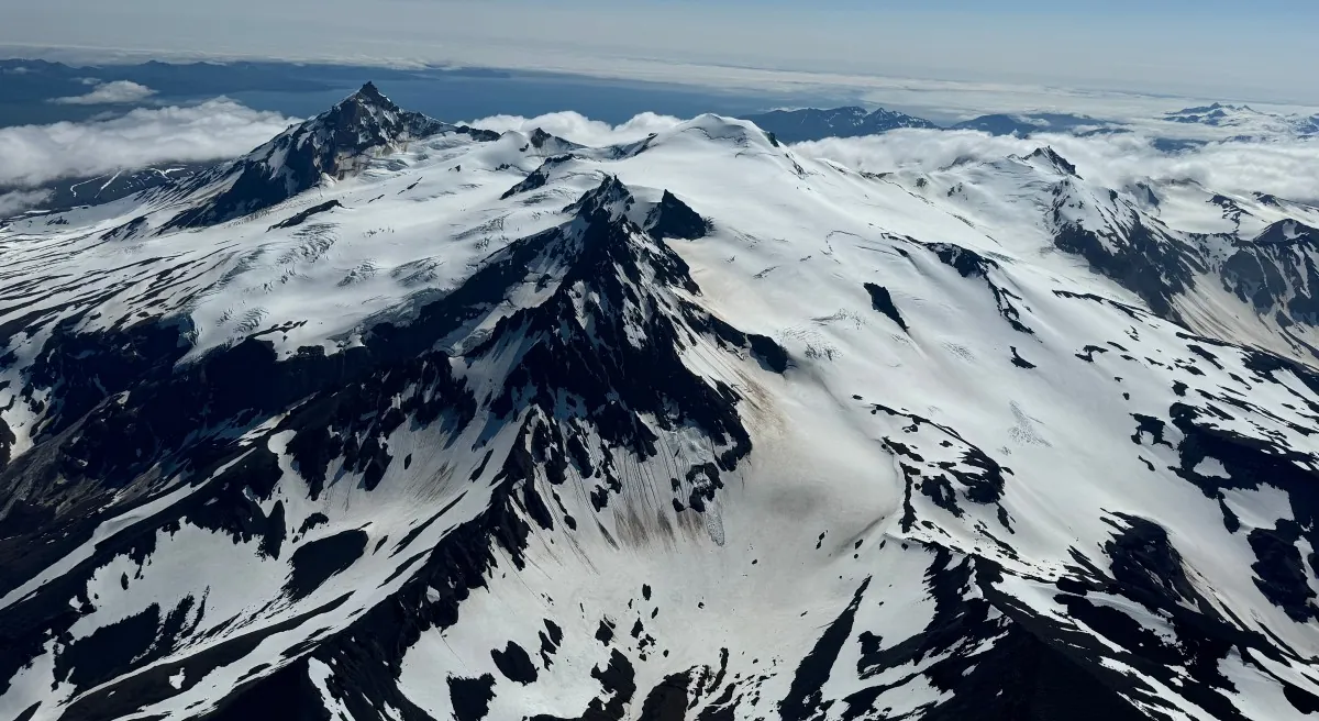 Aerial view of Kupreanof volcano in Alaska, showing its heavily glaciated summit