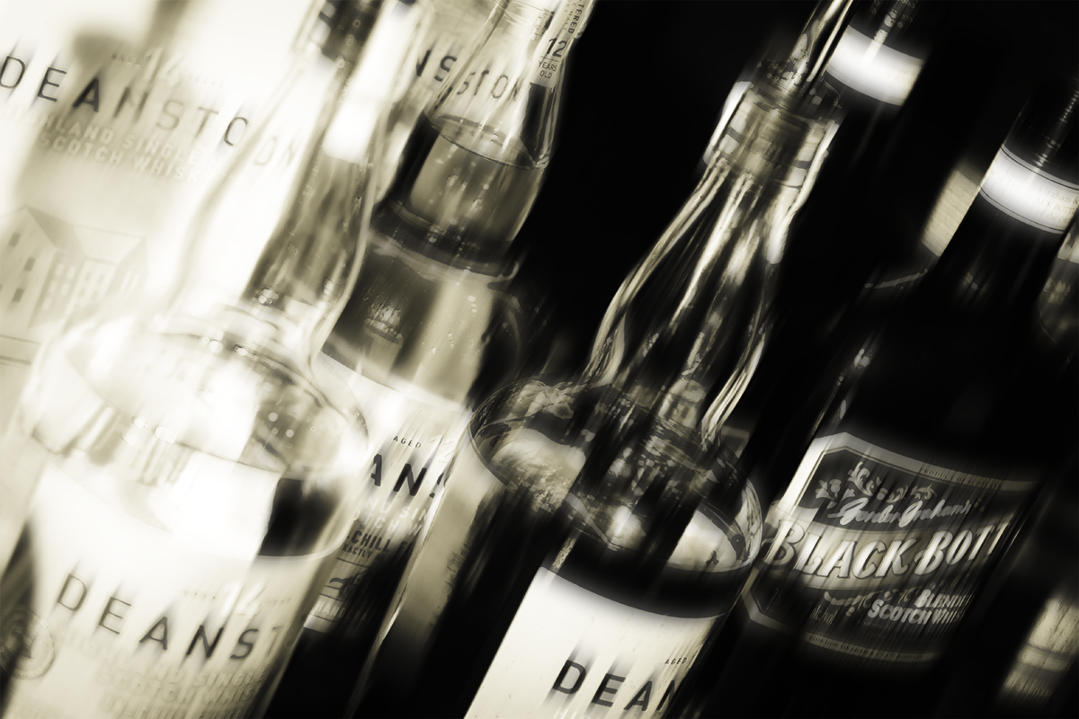 Blurred whisky bottles representing industry news coverage this week