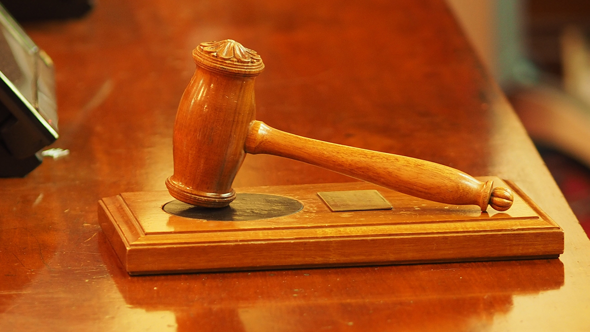 WTO gavel and building