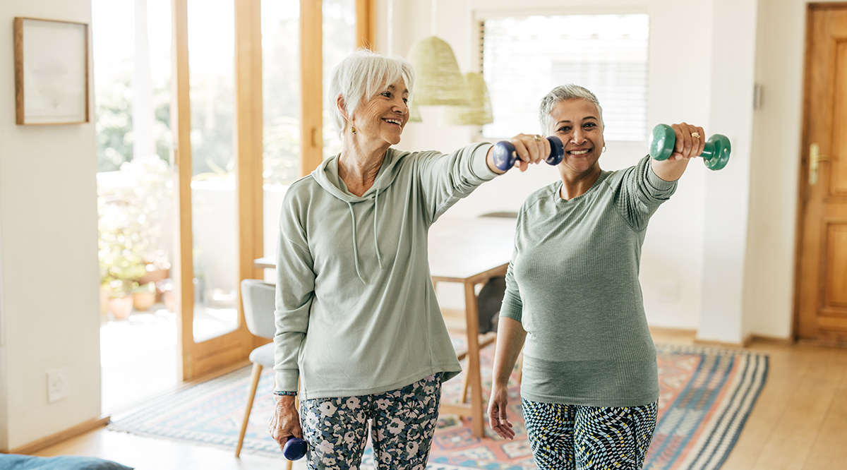 Older women lifting weights, illustrating healthspan research at longevity clinics