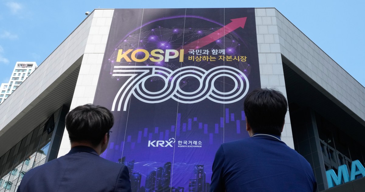 Novice investors monitoring stock charts on screens in Korea's brokerage house