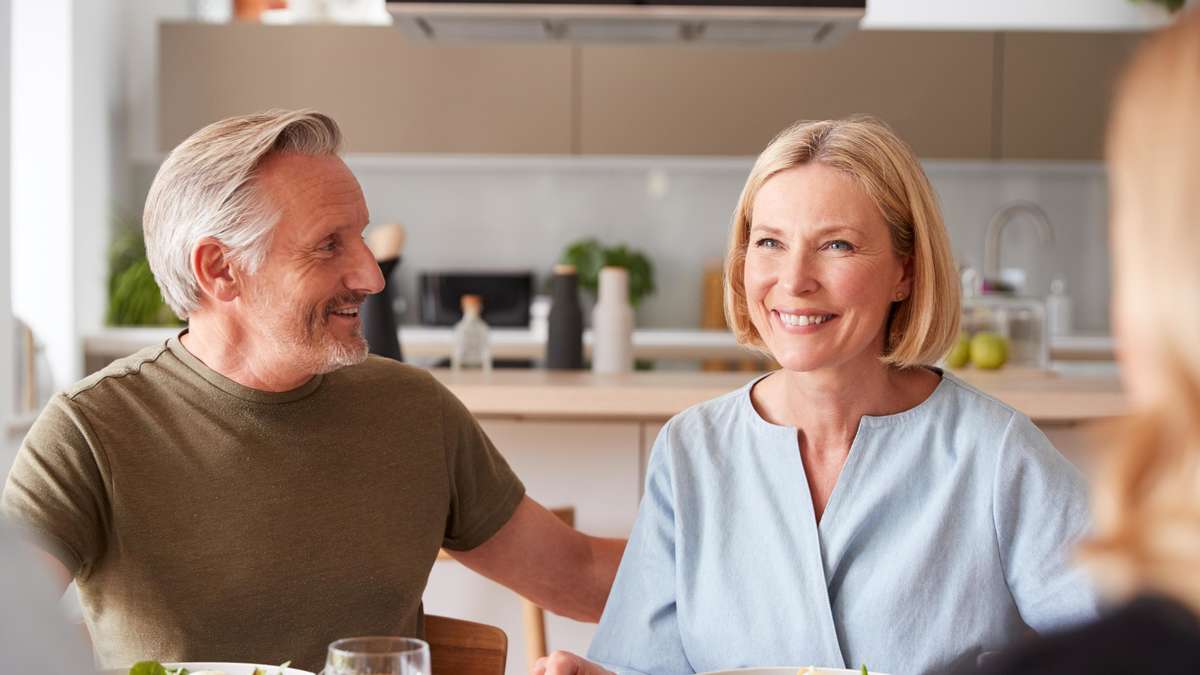 Family with senior parents eating