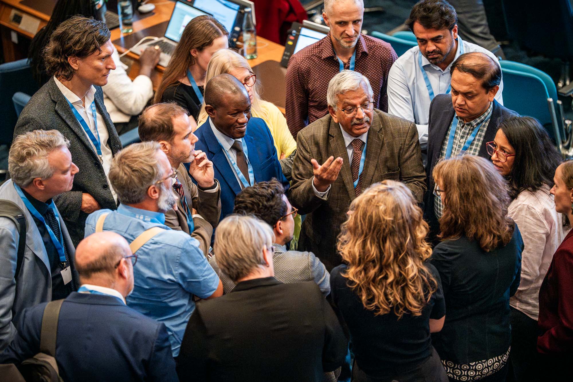IPCC meeting huddle highlighting the equity questions facing the assessment process