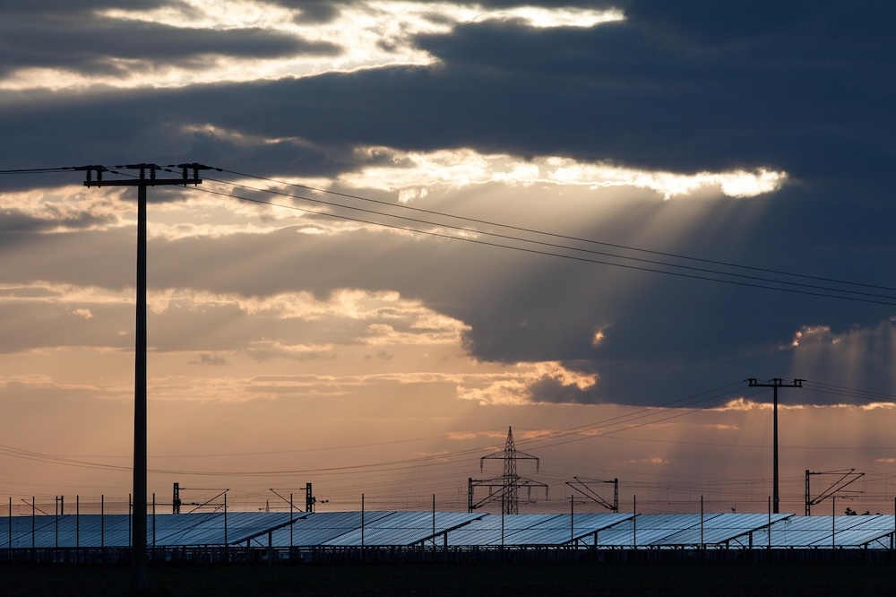Battery storage facility with solar panels visible