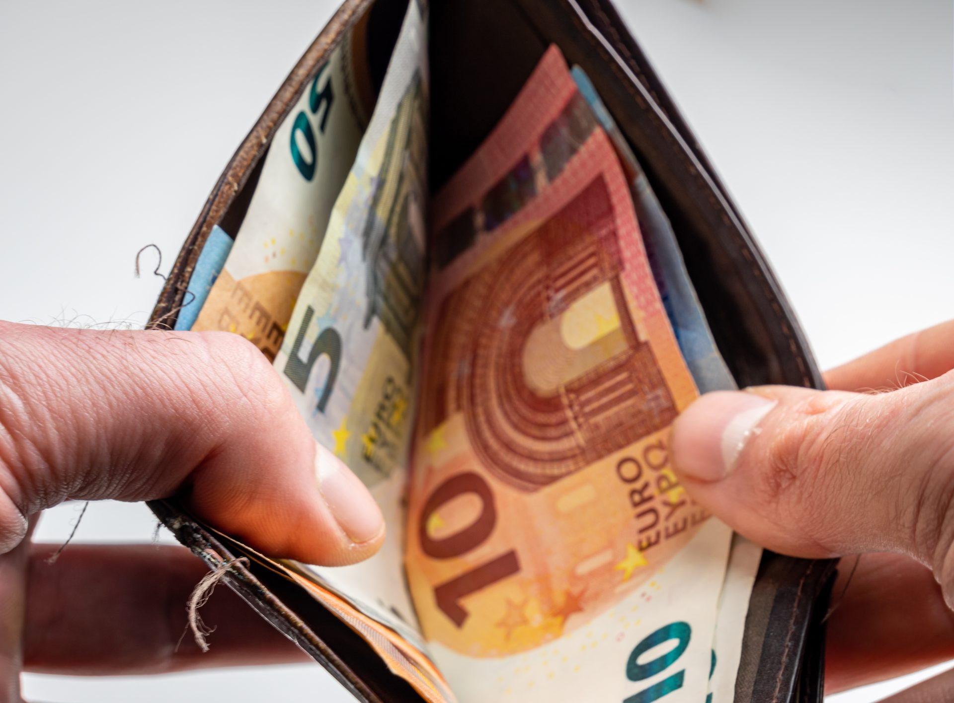 German Euro banknotes representing wage and tax adjustments