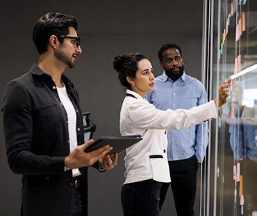 Grant Thornton team working on digital governance screen