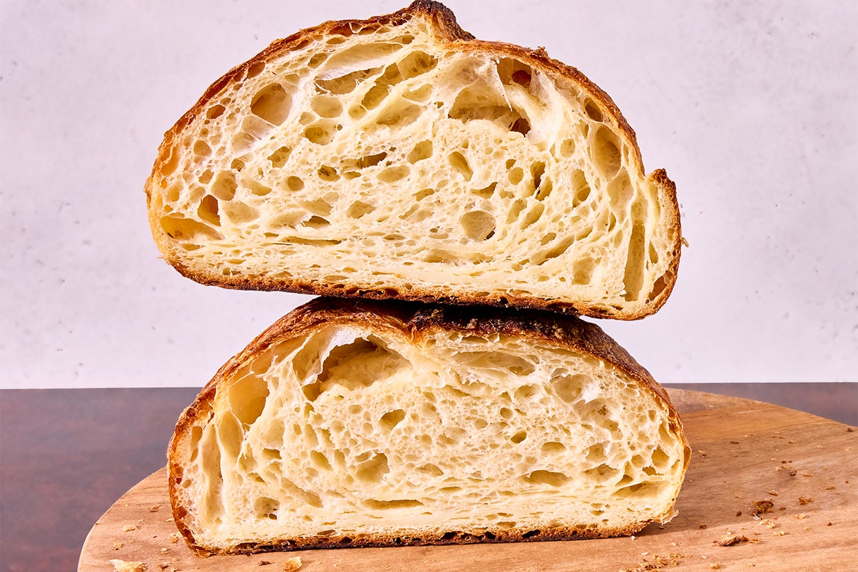 Croissant sourdough bread with golden-brown crust and visible laminated layers