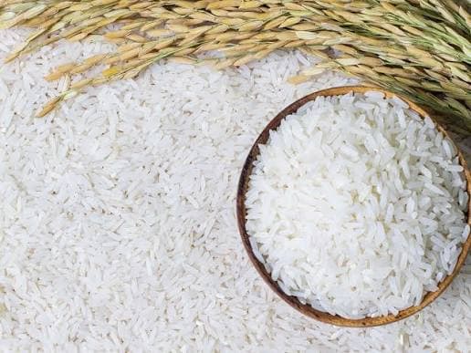 Image of imported rice bags in a market setting
